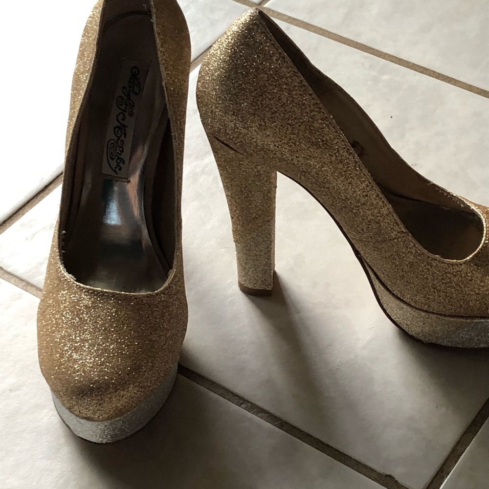 Gold and simmer pumps. New. Never worn. Size 6 1/2